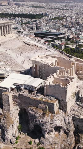 Ancient Acropolis ruins above city of Athens Greece, vertical video