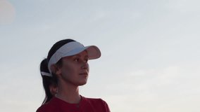 Woman golfer grips golf club preparing confident golf swing - Powered by Shutterstock - Get 15% off with code: PIKWIZARD15