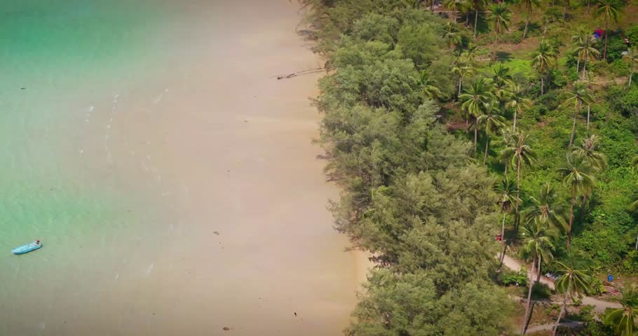 "Beautiful Tropical Beach Shoreline in Thailand with Clear Blue Water, Golden Sand, and Serene Coastal Scenery Under Bright Sunlight"
