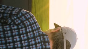 Industrial agrarian male farmer examining green wheat field plantation at sunset use laptop closeup. Modern technician agricultural scientist agronomist analyzing crop cultivation produce back view - Powered by Shutterstock - Get 15% off with code: PIKWIZARD15