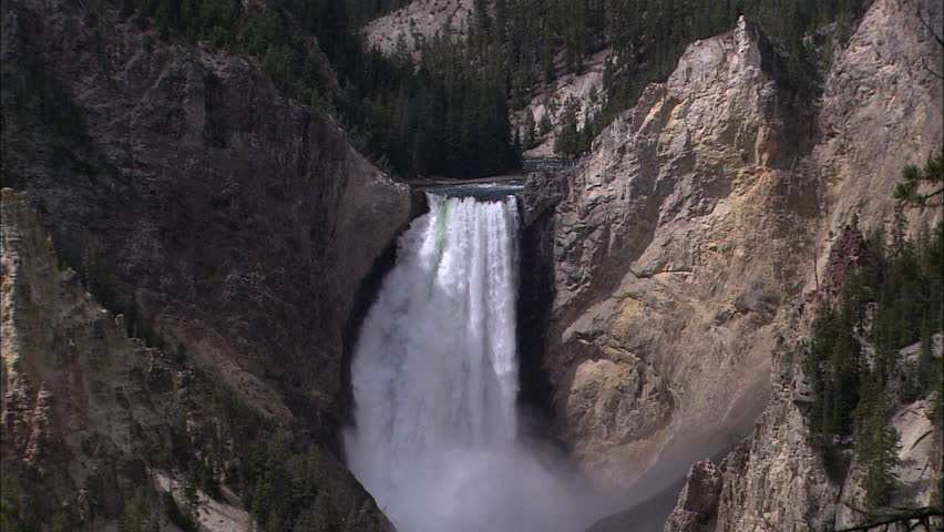 Zoom out from a giant waterfall to the valleys of Yellowstone
