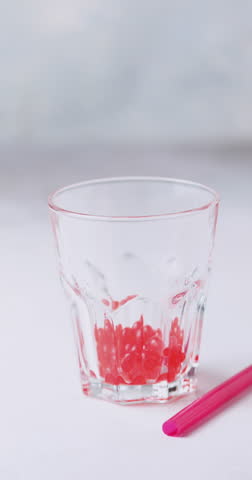 Cold iced fruit bubble tea with juice balls in glass