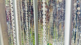 Shimmering bead curtain, sparkling light decorations, festive event backdrop, hanging crystal beads, illuminated party decor, luxury interior design, dazzling reflective strands, glamorous wedding - Powered by Shutterstock - Get 15% off with code: PIKWIZARD15