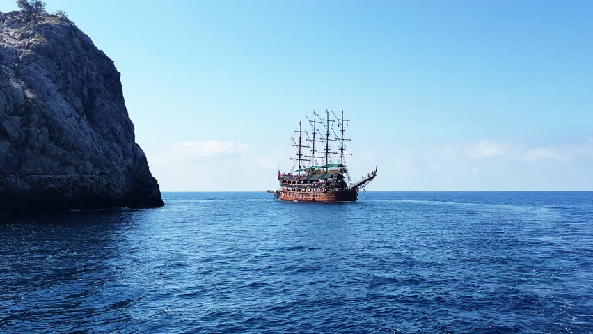 Old ship on the ocean. Large pirate ship on the Sea