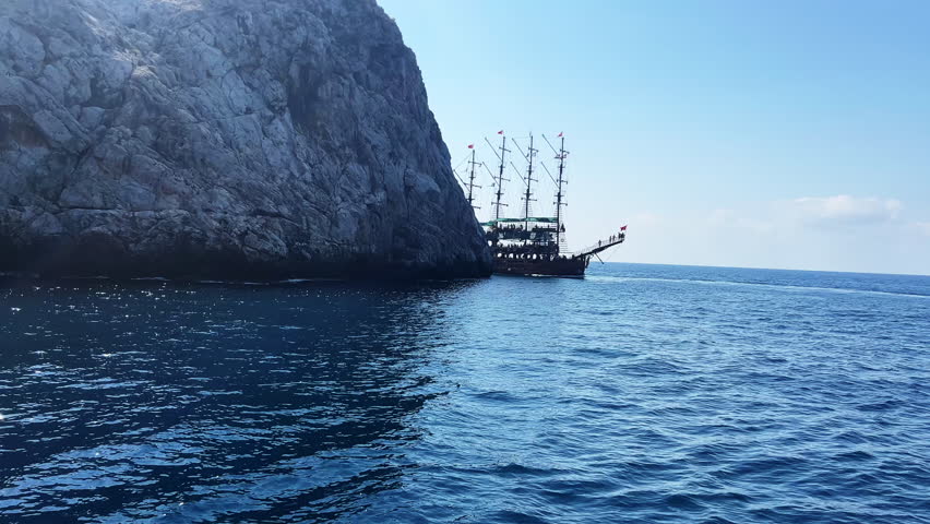 Old ship on the ocean. Large pirate ship on the Sea