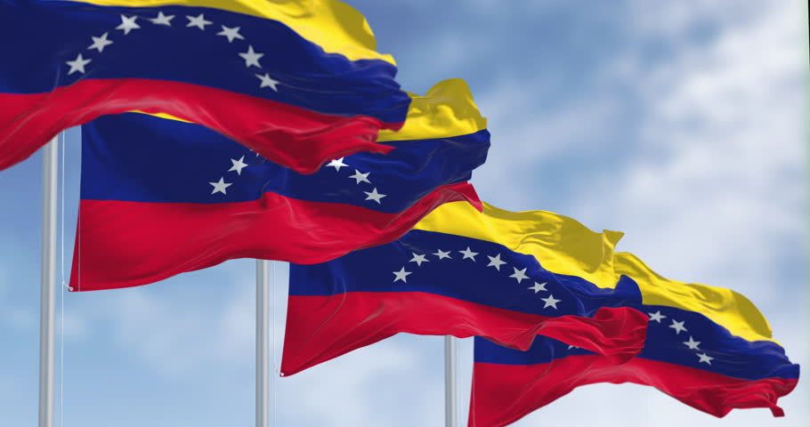 Venezuela national flags waving on a clear day. Yellow, blue and red stripes with an arc of eight white stars in the center. Seamless 3d render animation. Slow motion loop. Selective focus
