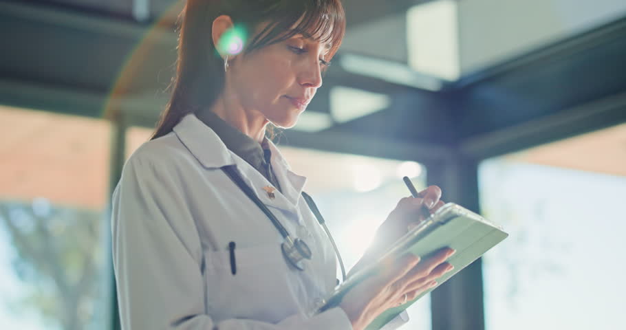 Thinking, doctor and woman with tablet in hospital for planning, research or medical idea. Technology, healthcare professional or problem solving in clinic for wellness, telehealth decision or vision