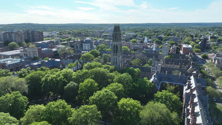 Lush Green Trees At Old Campus Courtyard Park With Harkness Tower At Yale University In New Haven, Connecticut, USA. - aerial shot