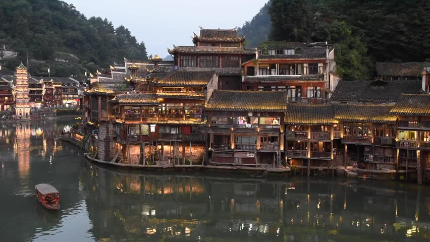 Fenghuang Ancient Town in Hunan Province, China, is a famous historic town known for its traditional Chinese architecture, stilt houses, cobblestone streets, and scenic riverside views.