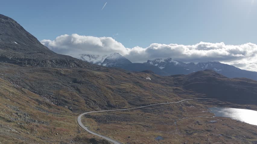 Areal footage of one of Norway's scenic routs showing beautiful landscape of Jotunheimen National Park in autumn