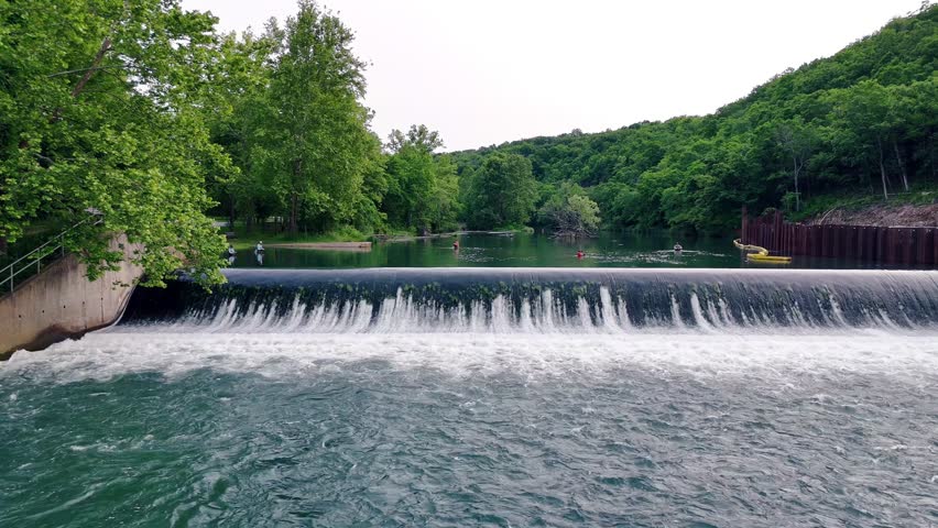 A group of fishermen fly-fish in the clear spring water at Bennett Spring State Park in Lebanon, Missouri.