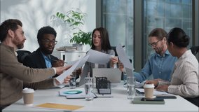 Diverse business team discussion together businesswomen businessmen women men talking showing papers documents coworkers planning analyzing in office briefing meeting conference multiethnic colleagues - Powered by Shutterstock - Get 15% off with code: PIKWIZARD15