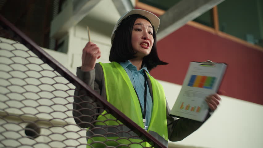 Asian Korean woman businesswoman builder business manager female shouting screaming Chinese Japanese girl angry mad aggressive architect engineer contractor in helmet hardhat yelling control building