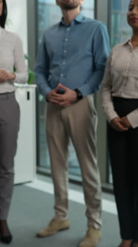 Two businesspeople shaking hands handshake agreement deal contract client director success diversity happy workers in background applaud congratulations celebrate office business company partnership