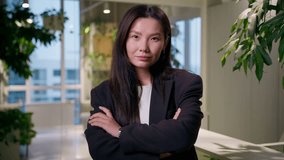 Successful businesswoman Asian business woman Korean girl entrepreneur in office posing with crossed hands confident employer leader indoors Japanese Chinese female architect designer modern company - Powered by Shutterstock - Get 15% off with code: PIKWIZARD15