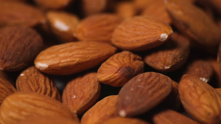 Raw Almonds Roasting and Spinning in the Pan