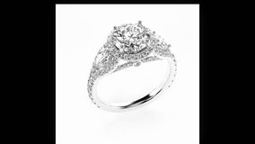 A dazzling, seamlessly looping close-up shot of a luxury diamond ring (e.g., a solitaire, eternity band, or specific cut). The video features the ring rotating smoothly on a [Specify Background: e.g., - Powered by Shutterstock - Get 15% off with code: PIKWIZARD15