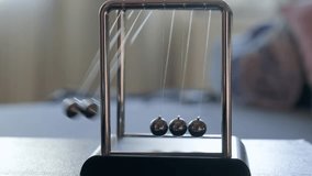 Newton's Small Pendulum in Action - Powered by Shutterstock - Get 15% off with code: PIKWIZARD15