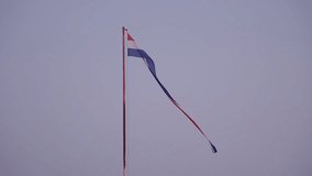Large Croatian flag waving at sunset from Dubrovnik cable car viewpoint, Croatia. The national flag flutters against a magenta sky, perfect for patriotic, travel and landscape footage. - Powered by Shutterstock - Get 15% off with code: PIKWIZARD15