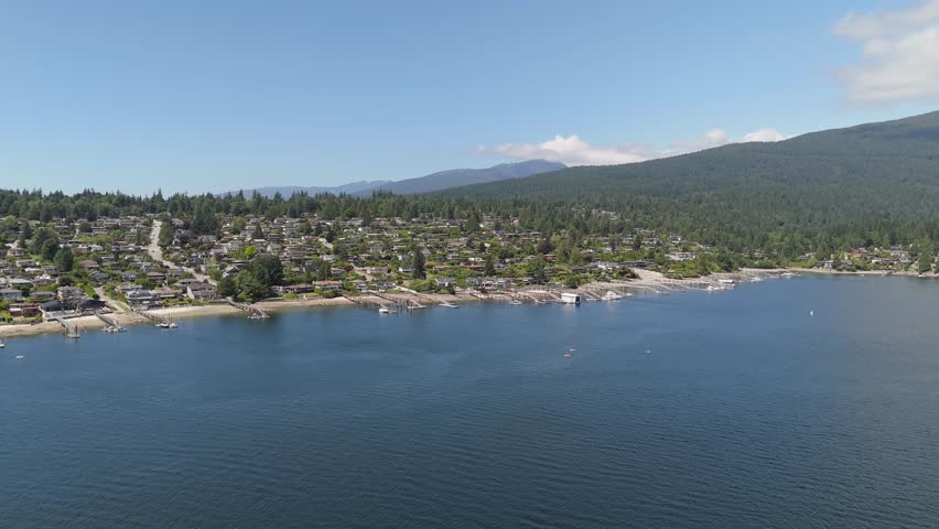 Aerial View of Scenic Coastal Residential Area with Mountains and Boats in British Columbia, Canada