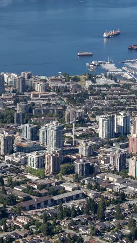 Aerial View of North Vancouver Cityscape and Harbor with Downtown Vancouver in the Distance, British Columbia. Images taken from Airplane
