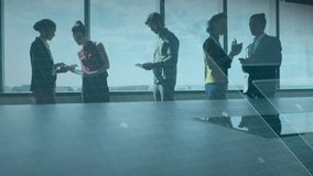 Business team examining tablets and initiating data overlays showing collaboration over skyline. Technology, teamwork, modern, innovation, networking, productivity, digital - Powered by Shutterstock - Get 15% off with code: PIKWIZARD15