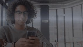 Man tapping phone starting pie chart and bar graph overlays while analyzing business data, smiling. Technology, data analysis, digital, innovation, workspace, communication, productivity - Powered by Shutterstock - Get 15% off with code: PIKWIZARD15