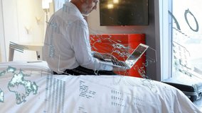 Senior male executive typing on laptop generating map overlay with global data for connectivity. Technology, communication, remote, business, innovation, modern, professional - Powered by Shutterstock - Get 15% off with code: PIKWIZARD15