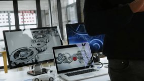 Mid-adult man picking up tablet and updating transparent bar chart overlay for financial analysis. Financial, data, technology, professional, modern, analytic, productivity - Powered by Shutterstock - Get 15% off with code: PIKWIZARD15