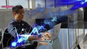 Man typing on laptop in office causing finance charts shifting and world-map nodes updating. Business, finance, data, analytics, technology, corporate, professional - Powered by Shutterstock - Get 15% off with code: PIKWIZARD15