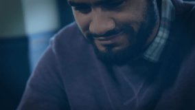 Seated man tilting tablet, causing translucent 3D globe with rotating red rings in technology demo. Technology, innovation, interface, 3d, digital, communication, modern - Powered by Shutterstock - Get 15% off with code: PIKWIZARD15