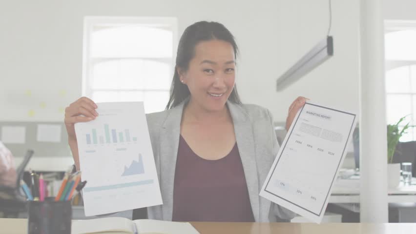 Businesswoman holding bar and line charts while adding security overlay and explaining data. Professional, data, analytics, futuristic, corporate, technology, innovation - Powered by Shutterstock - Get 15% off with code: PIKWIZARD15