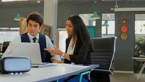 Business colleagues gesturing at laptop analyzing data as charts fading, shaking hands sealing deal. Collaboration, teamwork, data analysis, modern office, professional, business meeting - Powered by Shutterstock - Get 15% off with code: PIKWIZARD15