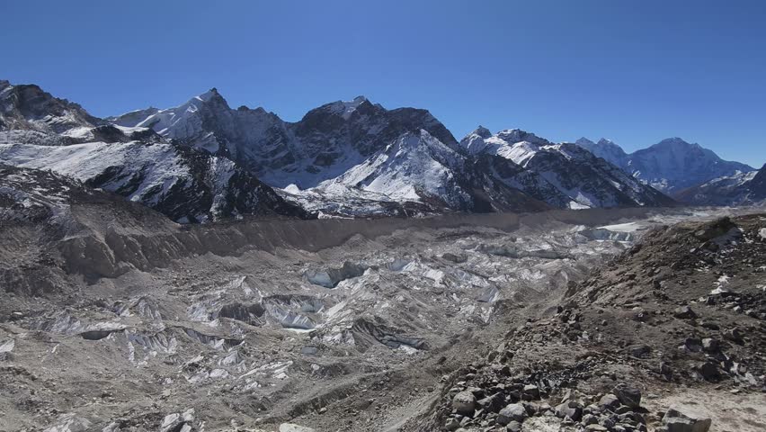 A vast landscape of the Himalayan mountain range near the Everest Base Camp under the afternoon sky