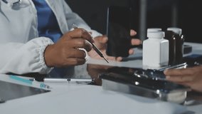 Medical professionals in scrubs discussing patient care, analyzing data on a clipboard in a meeting, Diagnosis and treatment planning. - Powered by Shutterstock - Get 15% off with code: PIKWIZARD15