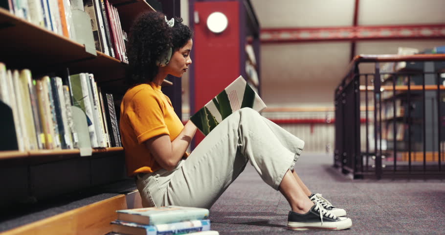 Reading, book and woman with headphones, library and assignment preparation with literature or info. Learning, university student and person with tech to block distractions, education and knowledge