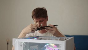 Man installing new internal pci express wi-fi network adapter card with external antennas into desktop computer case to upgrade connectivity and speed. Concept of desktop PC maintenance and service. - Powered by Shutterstock - Get 15% off with code: PIKWIZARD15