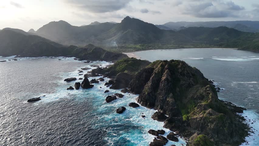 Rocky Coastline and Lush Hills Aerial, Serene Ocean Scenery