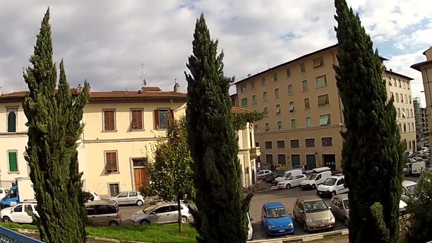 Building facades on the residential street in Florence, Italy, Europe. Bridge above the railroad. Fish eye lens, go pro hero.