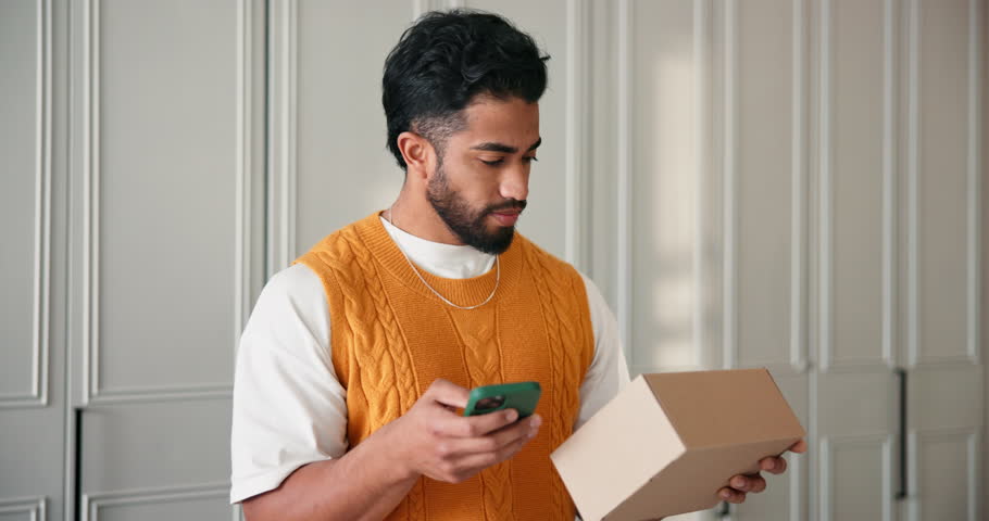 Happy man, delivery and phone with box for review, notification or verification in home. Male person, online shopping and parcel with mobile smartphone or smile for ecommerce app or courier service