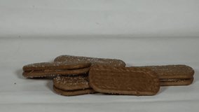 Hands breaking chocolate biscuits, showing the layers and texture of the treat. Great for snack or dessert concepts. - Powered by Shutterstock - Get 15% off with code: PIKWIZARD15