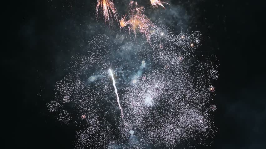 colorful festive fireworks for New Year celebrations on background of the night sky
