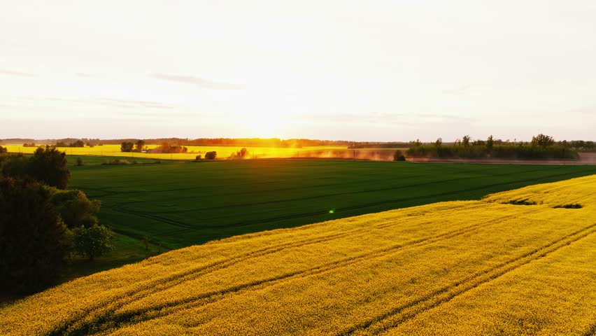 Beautiful Countryside Sunset Scene Showing Dust Cloud Over Farmland Road