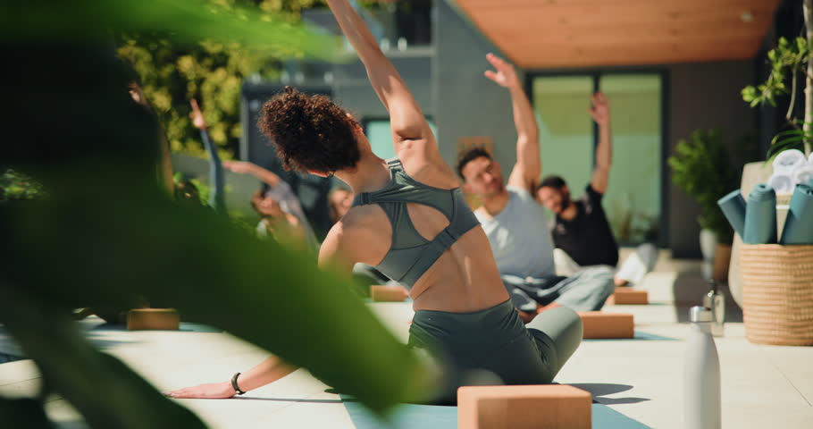 Fitness, outdoor and instructor with class for pilates workout with wellness, health and training. Calm, balcony and back of trainer with group of people for yoga exercise together with stretching.