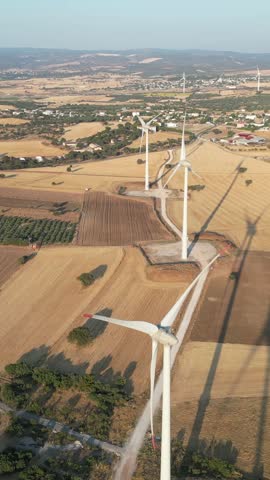 Aerial video of windmills at sunset