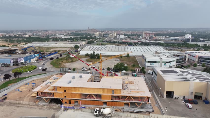 aerial views of a contruction site and the city