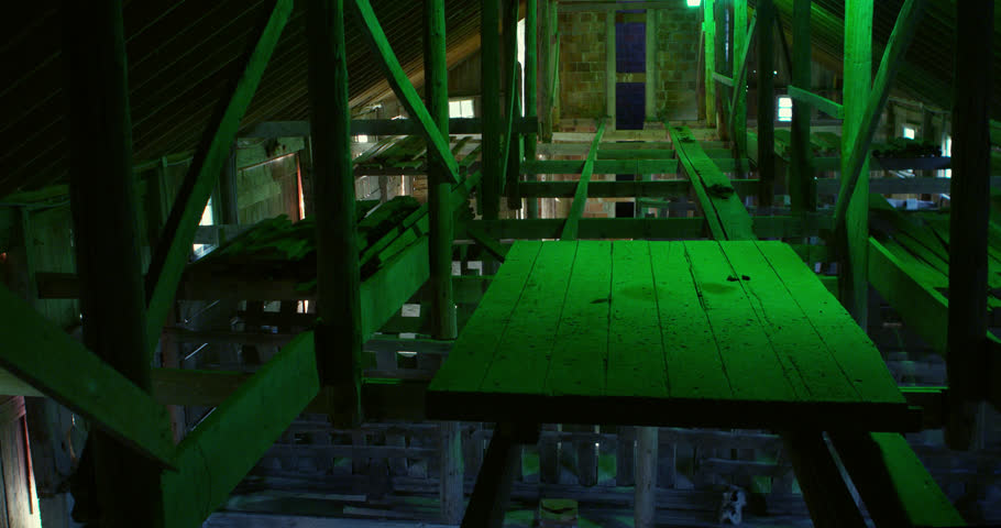 Hay trolly cart system in the historic Secrest 1883 octagonal barn, to restock cattle toughs down below.  At the end is a red brick grain silo.