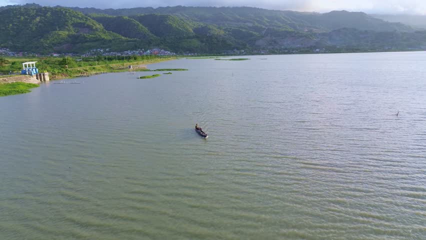 Lake Landscape with Boat and Mountains
