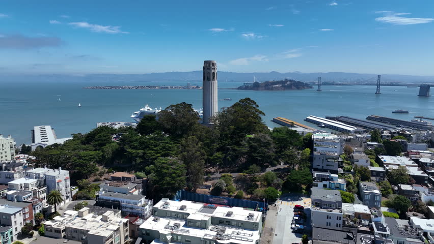 Aerial View Of Coit Tower With San Francisco Bay And San Francisco - Oakland Bay Bridge In California, USA.