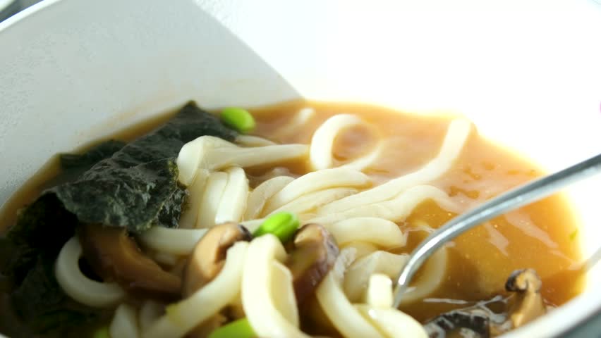 Noodle soup bowl Tasty spicy Asian noodle bowl.. Eating Chinese Ramen Soup. Cooked Delicious Instant Noodles With Vegetables. Asian Dinner Cooking. Quick Ramen With Dry Vegetables. Chinese Food